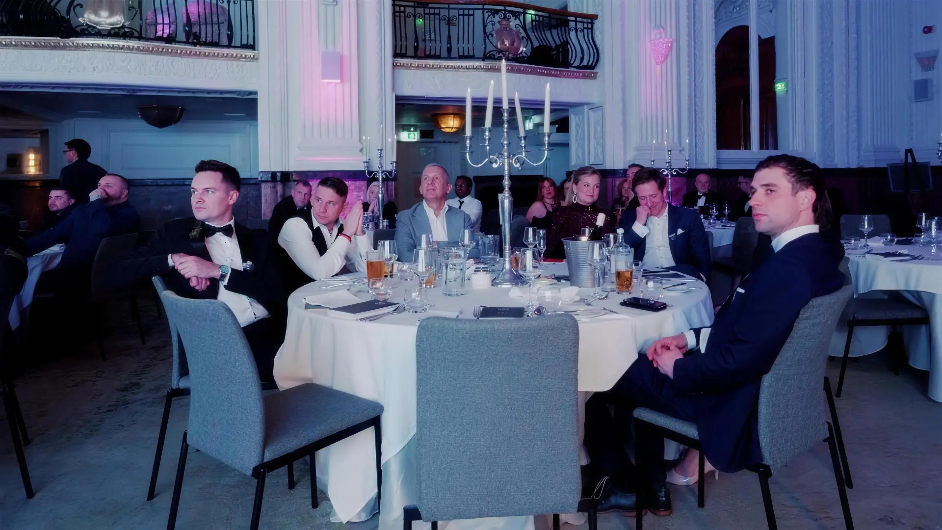 Guests seated at a candlelit dinner table during last year's event